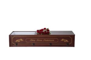 Personalized casket exterior in cherry wood with monogram detail name etched on the side